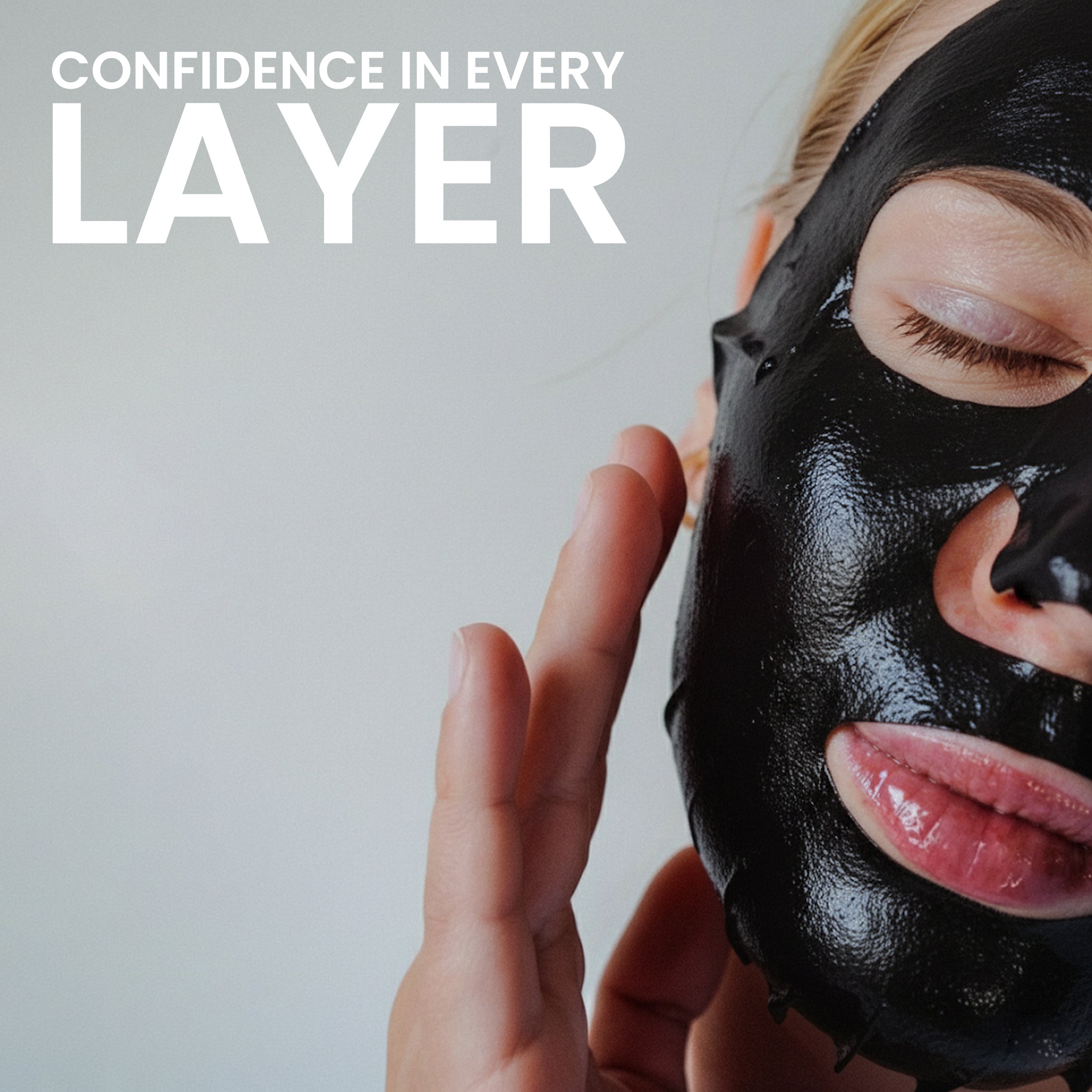 Woman applying Rivaj UK charcoal sheet mask on face showing smooth layering and deep cleansing skincare routine